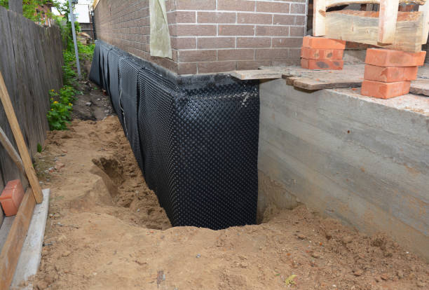 SJ Waterproofing Pros technician performing targeted Waterproofing assessment in Cullman, AL